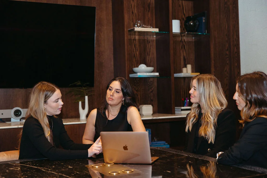 Four Sellers Hub team members working a search together